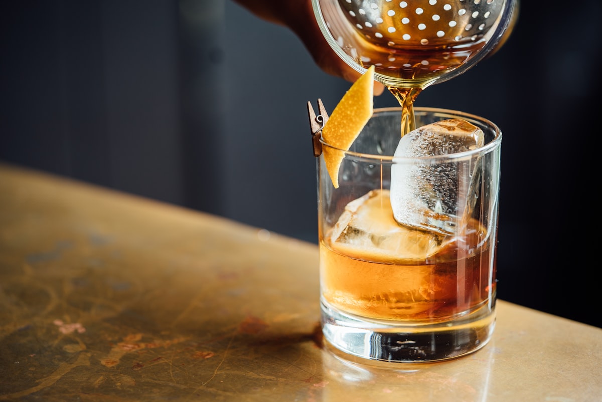 Cocktail served in a moody bar setting